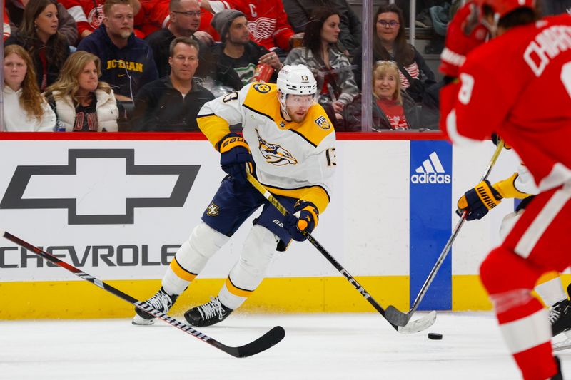 Dec 29, 2023; Detroit, Michigan, USA; Nashville Predators center Yakov Trenin (13) handles the puck during the third period of the game between the Detroit Red Wings and the Nashville Predators at Little Caesars Arena. Mandatory Credit: Brian Bradshaw Sevald-USA TODAY Sports