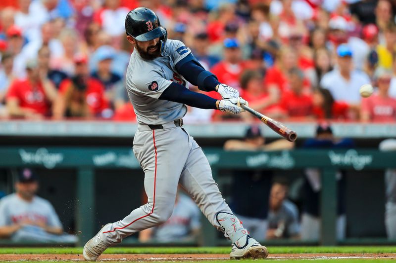 Jun 21, 2024; Cincinnati, Ohio, USA; Boston Red Sox catcher Connor Wong (12) hits a solo home run in the second inning against the Cincinnati Reds at Great American Ball Park. Mandatory Credit: Katie Stratman-USA TODAY Sports