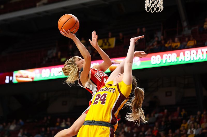 Feb 8, 2024; Minneapolis, Minnesota, USA; Ohio State Buckeyes guard Jacy Sheldon (4) shoots as Minnesota Golden Gophers forward Mallory Heyer (24) defends during the second half at Williams Arena. Mandatory Credit: Matt Krohn-USA TODAY Sports