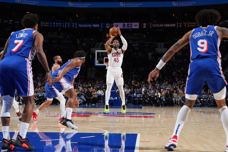 PHILADELPHIA, PA - NOVEMBER 13: Donovan Mitchell #45 of the Cleveland Cavaliers shoots a three point basket during the game against the Philadelphia 76ers on November 13, 2024 at the Wells Fargo Center in Philadelphia, Pennsylvania NOTE TO USER: User expressly acknowledges and agrees that, by downloading and/or using this Photograph, user is consenting to the terms and conditions of the Getty Images License Agreement. Mandatory Copyright Notice: Copyright 2024 NBAE (Photo by Jesse D. Garrabrant/NBAE via Getty Images)