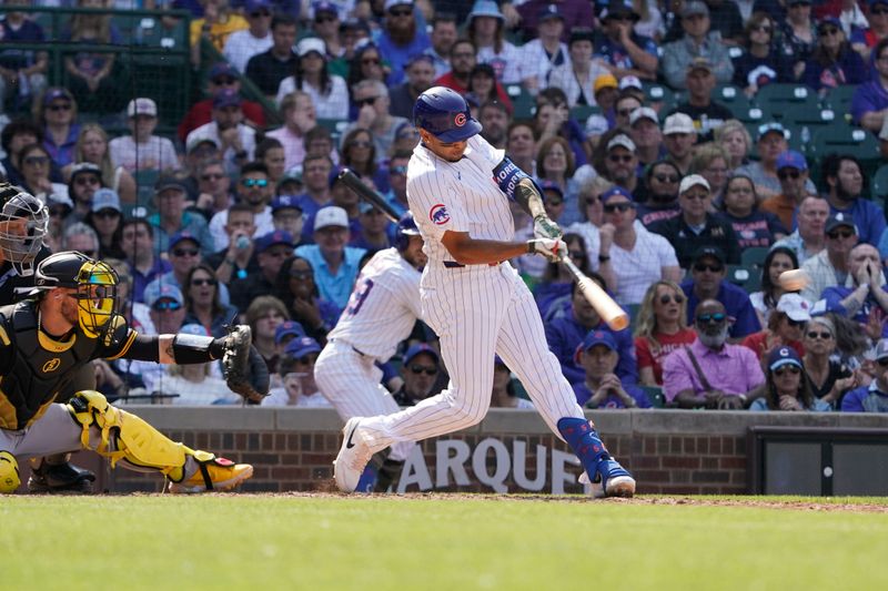 May 17, 2024; Chicago, Illinois, USA; Chicago Cubs third baseman Christopher Morel (5) hits a two run double against the Pittsburgh Pirates during the eighth inning at Wrigley Field. Mandatory Credit: David Banks-USA TODAY Sports