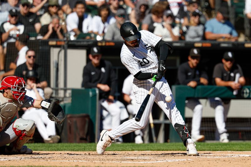 Sep 26, 2024; Chicago, Illinois, USA; Chicago White Sox outfielder Miguel Vargas (20) grounds into a force out against the Los Angeles Angels during the fifth inning at Guaranteed Rate Field. Mandatory Credit: Kamil Krzaczynski-Imagn Images