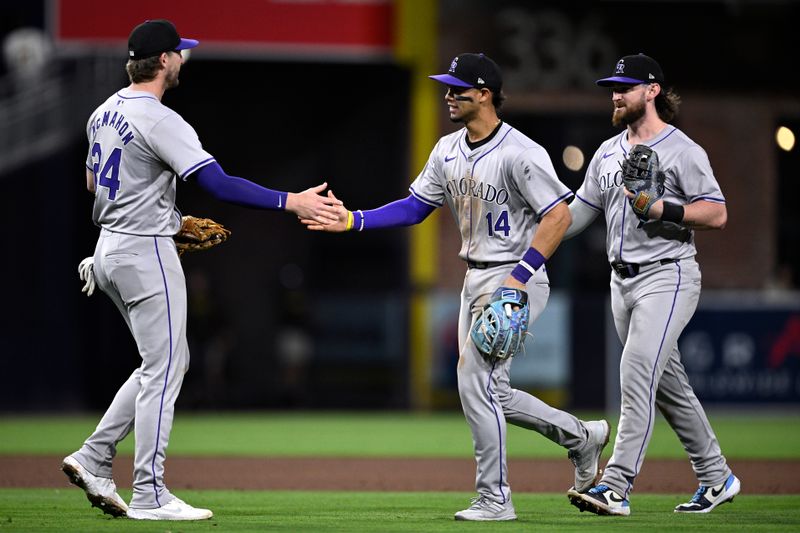 May 13, 2024; San Diego, California, USA; Colorado Rockies third baseman Ryan McMahon (24) celebrates on the field with Colorado Rockies shortstop Ezequiel Tovar (14) after defeating the San Diego Padres at Petco Park. Mandatory Credit: Orlando Ramirez-USA TODAY Sports