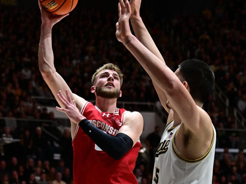 Mar 10, 2024; West Lafayette, Indiana, USA; Wisconsin Badgers forward Tyler Wahl (5) shoots the ball over Purdue Boilermakers center Zach Edey (15) during the first half at Mackey Arena. Mandatory Credit: Marc Lebryk-USA TODAY Sports