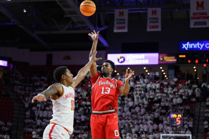 Dec 4, 2024; College Park, Maryland, USA;  Ohio State Buckeyes forward Sean Stewart (13) shoots over Maryland Terrapins forward Julian Reese (10) during the first half at Xfinity Center. Mandatory Credit: Reggie Hildred-Imagn Images