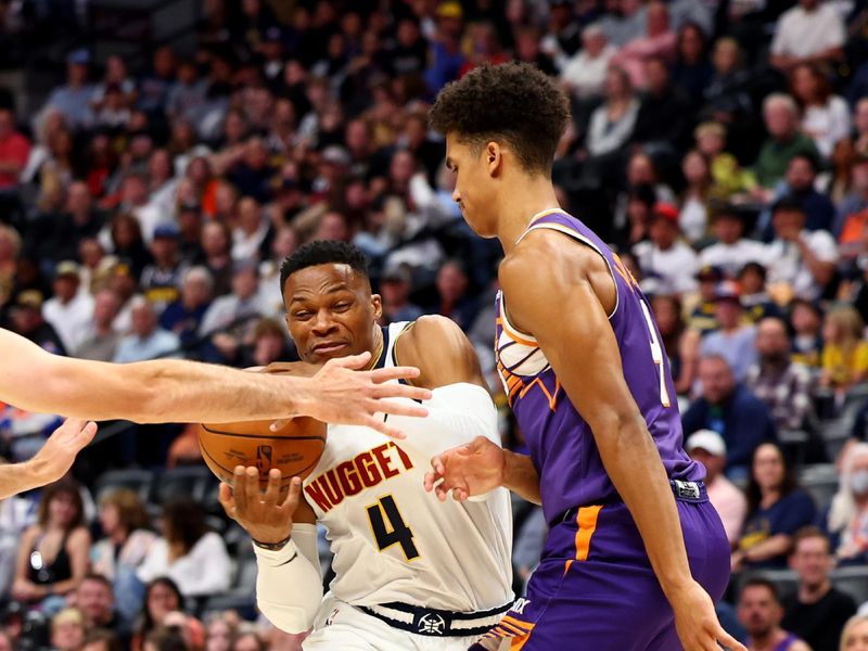 DENVER, COLORADO - OCTOBER 13: Russell Westbrook #4 of the Denver Nuggets drives to the basket against the Phoenix Suns at Ball Arena on October 13, 2024 in Denver, Colorado. NOTE TO USER: User expressly acknowledges and agrees that, by downloading and/or using this Photograph, user is consenting to the terms and conditions of the Getty Images License Agreement. (Photo by Jamie Schwaberow/Getty Images)