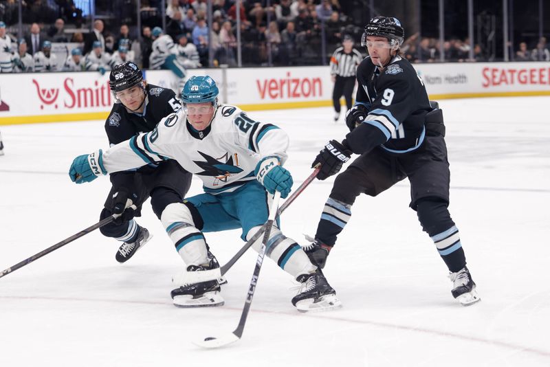 Oct 28, 2024; Salt Lake City, Utah, USA;  San Jose Sharks left wing Fabian Zetterlund (20) tries to keep control of the puck against the Utah Hockey Club at Delta Center. Mandatory Credit: Chris Nicoll-Imagn Images