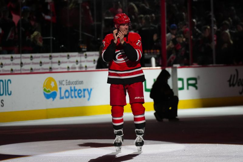 Jan 16, 2026; Raleigh, North Carolina, USA;  Carolina Hurricanes left wing Nikolaj Ehlers (27) celebrates their victory over the Florida Panthers at Lenovo Center. Mandatory Credit: James Guillory-Imagn Images