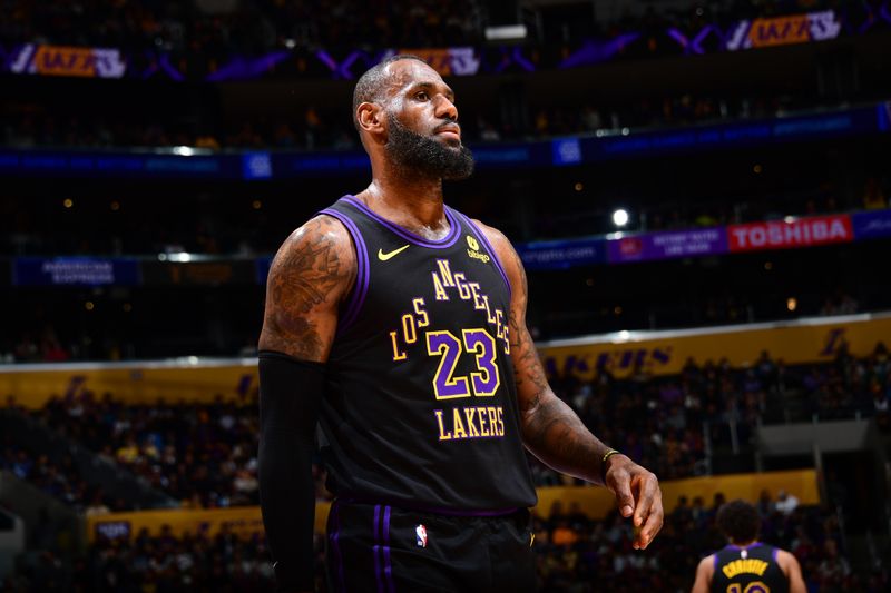 LOS ANGELES, CA - JANUARY 9: LeBron James #23 of the Los Angeles Lakers looks on during the game against the Toronto Raptors on January 9, 2024 at Crypto.Com Arena in Los Angeles, California. NOTE TO USER: User expressly acknowledges and agrees that, by downloading and/or using this Photograph, user is consenting to the terms and conditions of the Getty Images License Agreement. Mandatory Copyright Notice: Copyright 2024 NBAE (Photo by Adam Pantozzi/NBAE via Getty Images)