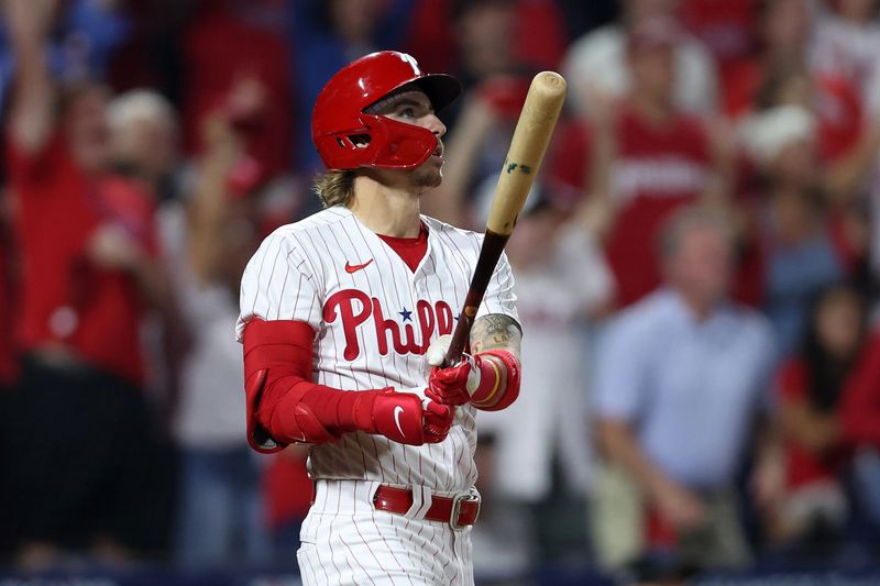 Oct 4, 2023; Philadelphia, Pennsylvania, USA; Philadelphia Phillies second baseman Bryson Stott (5) hits a grand slam against the Miami Marlins during the sixth inning for game two of the Wildcard series for the 2023 MLB playoffs at Citizens Bank Park. Mandatory Credit: Bill Streicher-USA TODAY Sports