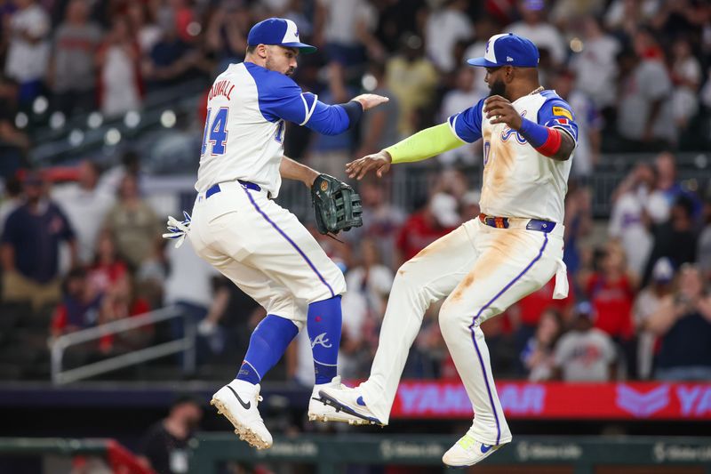 Aug 24, 2024; Atlanta, Georgia, USA; Atlanta Braves right fielder Adam Duvall (14) and designated hitter Marcell Ozuna (20) celebrate after a victory over the Washington Nationals at Truist Park. Mandatory Credit: Brett Davis-USA TODAY Sports
