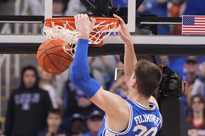 Mar 11, 2023; Greensboro, NC, USA;  Duke Blue Devils center Kyle Filipowski (30) scores in the second half of the Championship game of the ACC Tournament at Greensboro Coliseum. Mandatory Credit: Bob Donnan-USA TODAY Sports