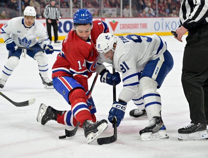 Mar 9, 2024; Montreal, Quebec, CAN: Montreal Canadiens forward Nick Suzuki (14) wins a faceoff against Toronto Maple Leafs forward John Tavares (91) during the first period at the Bell Centre. Mandatory Credit: Eric Bolte-USA TODAY Sports