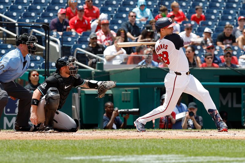 Jun 20, 2024; Washington, District of Columbia, USA;  Washington Nationals outfielder Lane Thomas (28) hits a solo home run against the Arizona Diamondbacks during the third inningat Nationals Park. Mandatory Credit: Geoff Burke-USA TODAY Sports