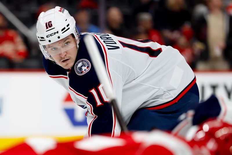 Nov 22, 2025; Detroit, Michigan, USA;  Columbus Blue Jackets left wing Dmitri Voronkov (10) gets set during a face off in the third period against the Detroit Red Wings at Little Caesars Arena. Mandatory Credit: Rick Osentoski-Imagn Images