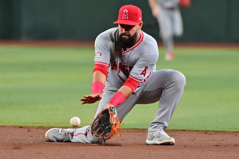 Jun 12, 2024; Phoenix, Arizona, USA; Los Angeles Angels second base Luis Guillorme (15) fields a ground ball in the first inning against the Arizona Diamondbacks at Chase Field. Mandatory Credit: Matt Kartozian-USA TODAY Sports