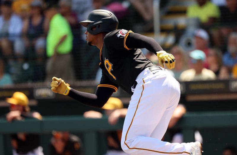 Mar 24, 2024; Bradenton, Florida, USA;  Pittsburgh Pirates third baseman Ke'Bryan Hayes (13) singles during the first inning against the New York Yankees at LECOM Park. Mandatory Credit: Kim Klement Neitzel-USA TODAY Sports