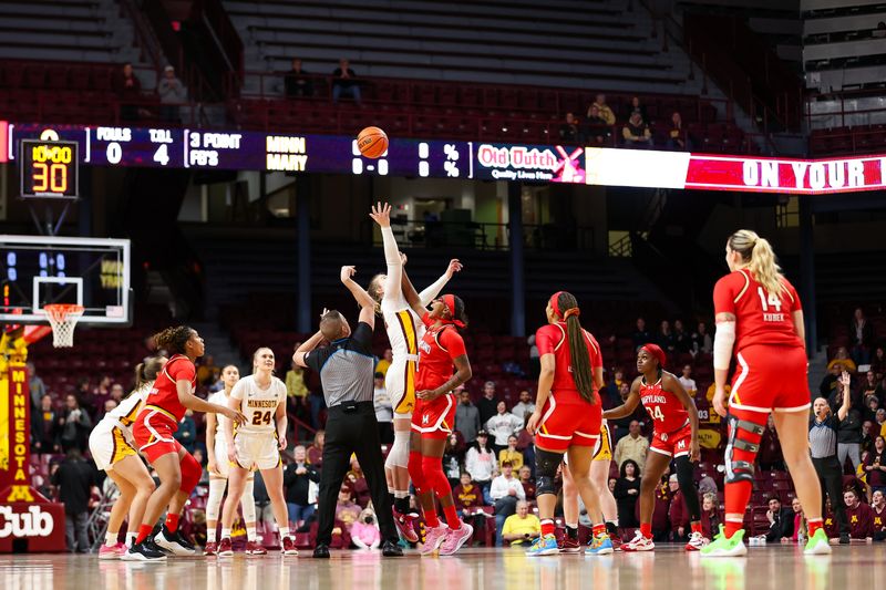 Jan 3, 2024; Minneapolis, Minnesota, USA; Minnesota Golden Gophers center Sophie Hart (52) and Maryland Terrapins guard Riley Nelson (2) jump for the ball during the first half at Williams Arena. Mandatory Credit: Matt Krohn-USA TODAY Sports