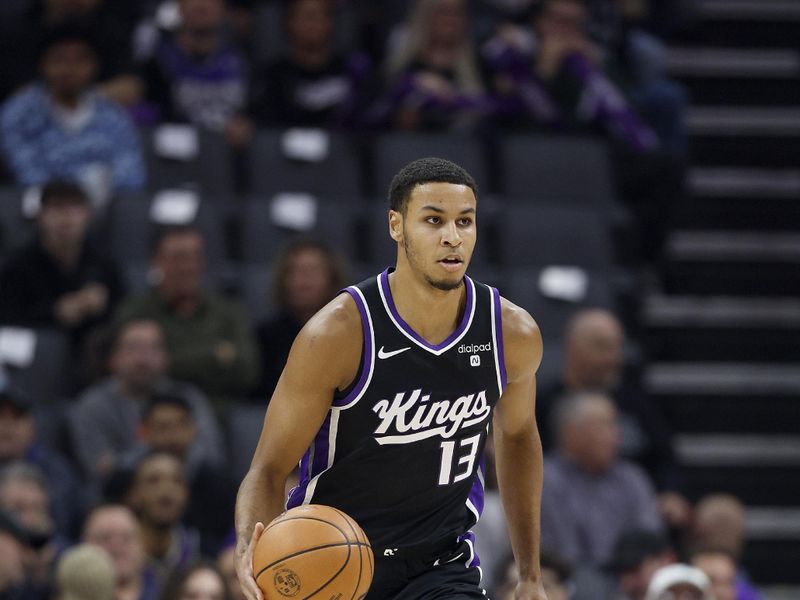 SACRAMENTO, CALIFORNIA - JANUARY 03: Keegan Murray #13 of the Sacramento Kings dribbles the ball up court against the Orlando Magic during the first half of an NBA basketball game at Golden 1 Center on January 03, 2024 in Sacramento, California. NOTE TO USER: User expressly acknowledges and agrees that, by downloading and or using this photograph, User is consenting to the terms and conditions of the Getty Images License Agreement. (Photo by Thearon W. Henderson/Getty Images)