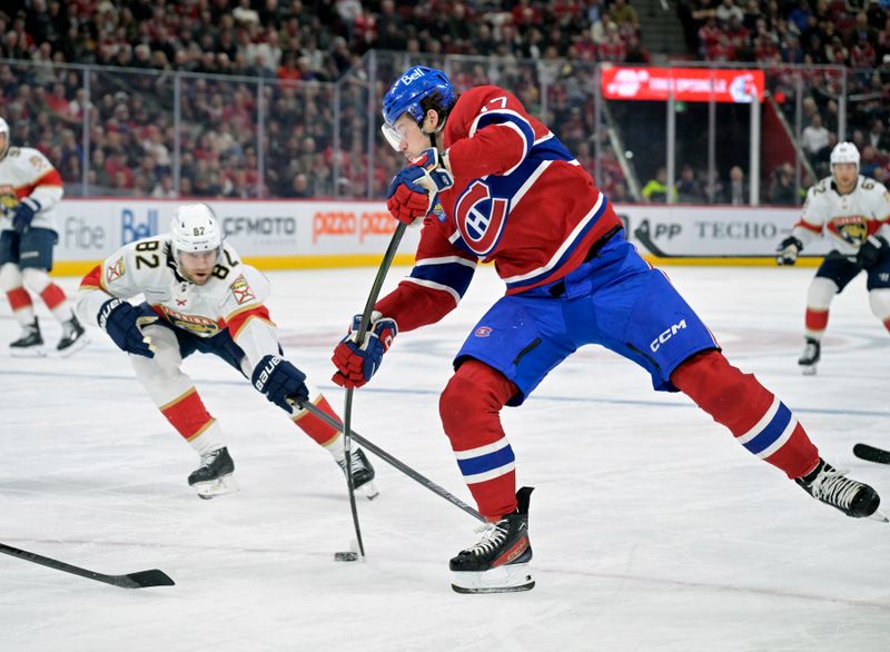 Apr 2, 2024; Montreal, Quebec, CAN; Montreal Canadiens forward Josh Anderson (17) takes a shot on net and Florida Panthers forward Kevin Stenlund (82) defends during the second period at the Bell Centre. Mandatory Credit: Eric Bolte-USA TODAY Sports