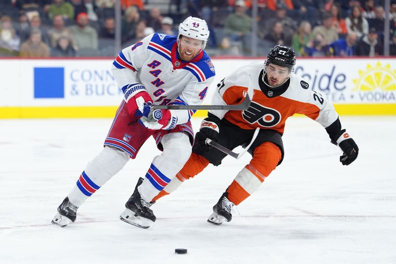 Jan 17, 2026; Philadelphia, Pennsylvania, USA; New York Rangers defenseman Vladislav Gavrikov (44) battles for the puck against Philadelphia Flyers left wing Noah Cates (27) in the second period at Xfinity Mobile Arena. Mandatory Credit: Kyle Ross-Imagn Images