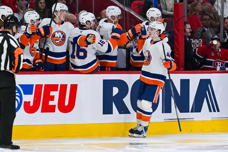 Mar 21, 2026; Montreal, Quebec, CAN; New York Islanders defenseman Matthew Schaefer (48) celebrates with his teammates at the bench his goal against the Montreal Canadiens during the third period at Bell Centre. Mandatory Credit: David Kirouac-Imagn Images