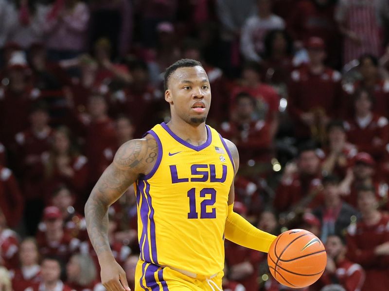 Jan 24, 2023; Fayetteville, Arkansas, USA; LSU Tigers forward KJ Williams (12) dribbles in the second half against the Arkansas Razorbacks at Bud Walton Arena. Arkansas won 60-40. Mandatory Credit: Nelson Chenault-USA TODAY Sports