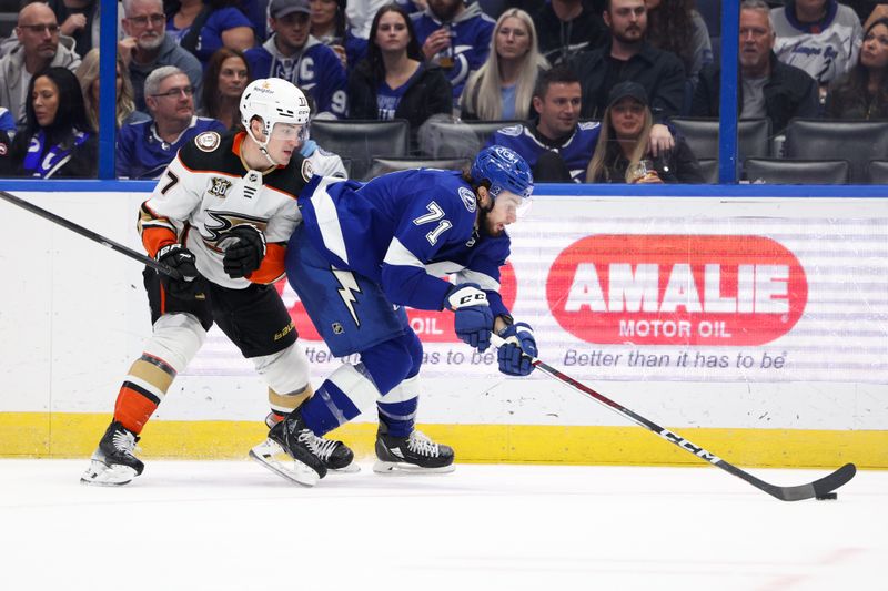 Jan 13, 2024; Tampa, Florida, USA;  Tampa Bay Lightning center Anthony Cirelli (71) controls the puck from Anaheim Ducks right wing Frank Vatrano (77) in the second period at Amalie Arena. Mandatory Credit: Nathan Ray Seebeck-USA TODAY Sports