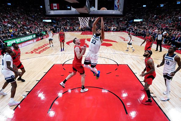 TORONTO, CANADA - OCTOBER 25: Karl-Anthony Towns #32 of the Minnesota Timberwolves dunks the ball during the game against the Toronto Raptors on October 25, 2023 at the Scotiabank Arena in Toronto, Ontario, Canada.  NOTE TO USER: User expressly acknowledges and agrees that, by downloading and or using this Photograph, user is consenting to the terms and conditions of the Getty Images License Agreement.  Mandatory Copyright Notice: Copyright 2023 NBAE (Photo by Mark Blinch/NBAE via Getty Images)