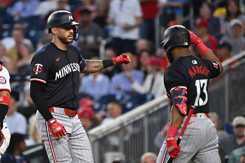 May 20, 2024; Washington, District of Columbia, USA; Minnesota Twins shortstop Carlos Correa (4) celebrates after hitting a home run with  outfielder Manuel Margot (13) against the Washington Nationals during the sixth inning at Nationals Park. Mandatory Credit: Rafael Suanes-USA TODAY Sports