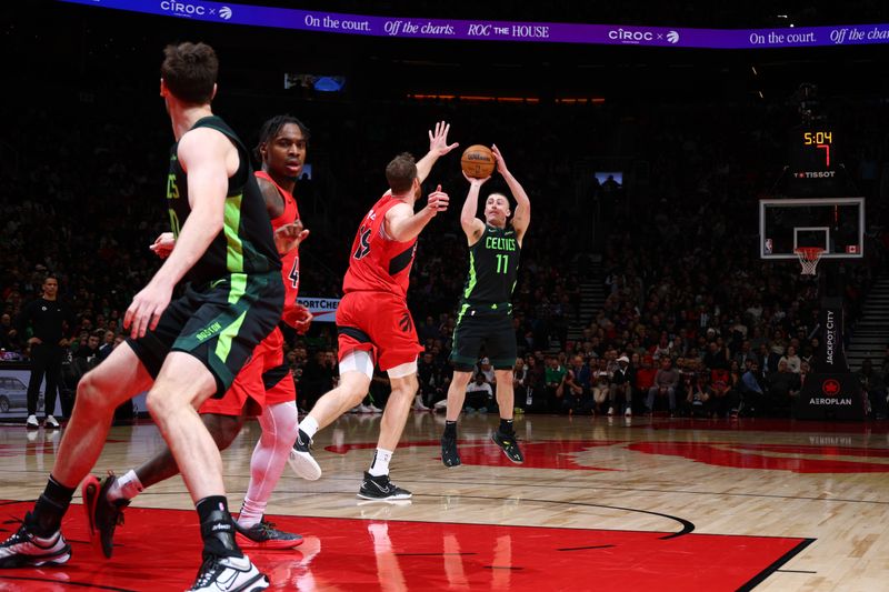 TORONTO, CANADA - JANUARY 15: Payton Pritchard #11 of the Boston Celtics shoots a three point basket during the game against the Toronto Raptors on January 15, 2025 at the Scotiabank Arena in Toronto, Ontario, Canada.  NOTE TO USER: User expressly acknowledges and agrees that, by downloading and or using this Photograph, user is consenting to the terms and conditions of the Getty Images License Agreement.  Mandatory Copyright Notice: Copyright 2025 NBAE (Photo by Vaughn Ridley/NBAE via Getty Images)