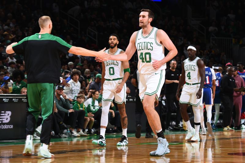 BOSTON, MA - OCTOBER 12: Sam Hauser #30 and Luke Kornet #40 of the Boston Celtics high five during the game against the Philadelphia 76ers during a NBA Preseason game on October 12, 2024 at TD Garden in Boston, Massachusetts. NOTE TO USER: User expressly acknowledges and agrees that, by downloading and/or using this Photograph, user is consenting to the terms and conditions of the Getty Images License Agreement. Mandatory Copyright Notice: Copyright 2024 NBAE (Photo by Brian Babineau/NBAE via Getty Images)