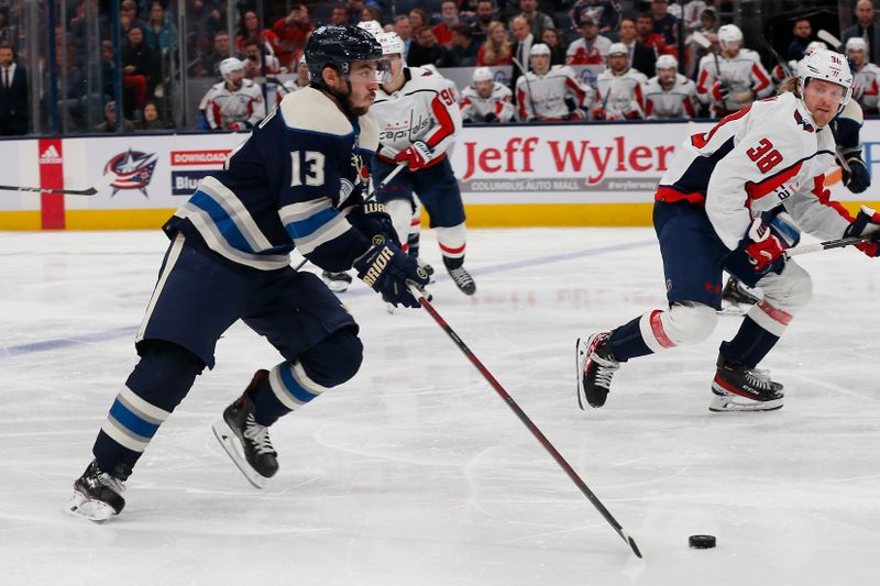 Dec 21, 2023; Columbus, Ohio, USA; Columbus Blue Jackets left wing Johnny Gaudreau (13) carries the puck against the Washington Capitals  during the third period at Nationwide Arena. Mandatory Credit: Russell LaBounty-USA TODAY Sports