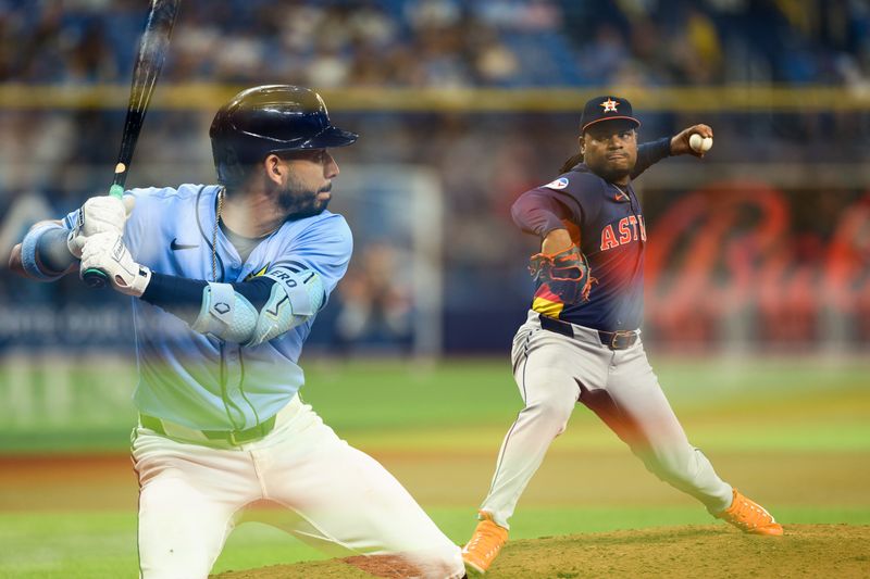Aug 12, 2024; St. Petersburg, Florida, USA; (editors note: in camera double exposure) Houston Astros pitcher Framber Valdez (59) throws a pitch to Tampa Bay Rays third baseman Jose Caballero (7) in the sixth inning  at Tropicana Field. Mandatory Credit: Nathan Ray Seebeck-USA TODAY Sports