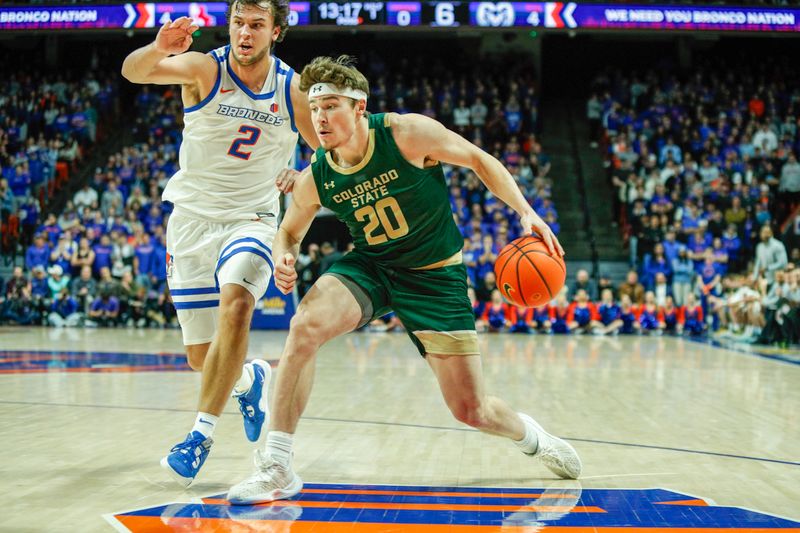 Jan 9, 2024; Boise, Idaho, USA; Colorado State Rams guard Joe Palmer (20) drives past Boise State Broncos forward Tyson Degenhart (2) during the first half at ExtraMile Arena. Mandatory Credit: Brian Losness-USA TODAY Sports
