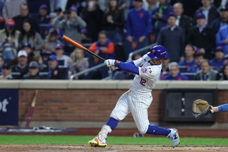 Oct 18, 2024; New York City, New York, USA; New York Mets shortstop Francisco Lindor (12) hits a triple in the third inning against the Los Angeles Dodgers during game five of the NLCS for the 2024 MLB playoffs at Citi Field. Mandatory Credit: Brad Penner-Imagn Images