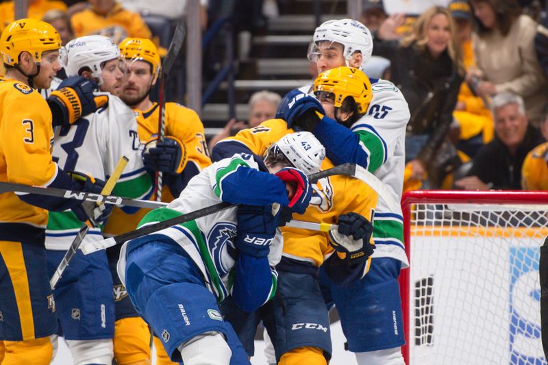 Apr 26, 2024; Nashville, Tennessee, USA; Nashville Predators center Gustav Nyquist (14), Vancouver Canucks right wing Ilya Mikheyev (65), and defenseman Quinn Hughes (43) fight during the first period in game three of the first round of the 2024 Stanley Cup Playoffs at Bridgestone Arena. Mandatory Credit: Steve Roberts-USA TODAY Sports