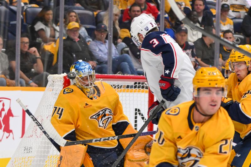Oct 9, 2025; Nashville, Tennessee, USA; Nashville Predators goaltender Juuse Saros (74) blocks the shot of Columbus Blue Jackets center Charlie Coyle (3) during the third period at Bridgestone Arena. Mandatory Credit: Steve Roberts-Imagn Images