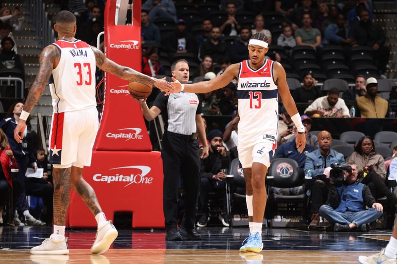 WASHINGTON, DC -? OCTOBER 18: Jordan Poole #13 and Kyle Kuzma #33 of the Washington Wizards high five during the game against the New York Knicks on October 18, 2024 at Capital One Arena in Washington, DC. NOTE TO USER: User expressly acknowledges and agrees that, by downloading and or using this Photograph, user is consenting to the terms and conditions of the Getty Images License Agreement. Mandatory Copyright Notice: Copyright 2024 NBAE (Photo by Kenny Giarla/NBAE via Getty Images)