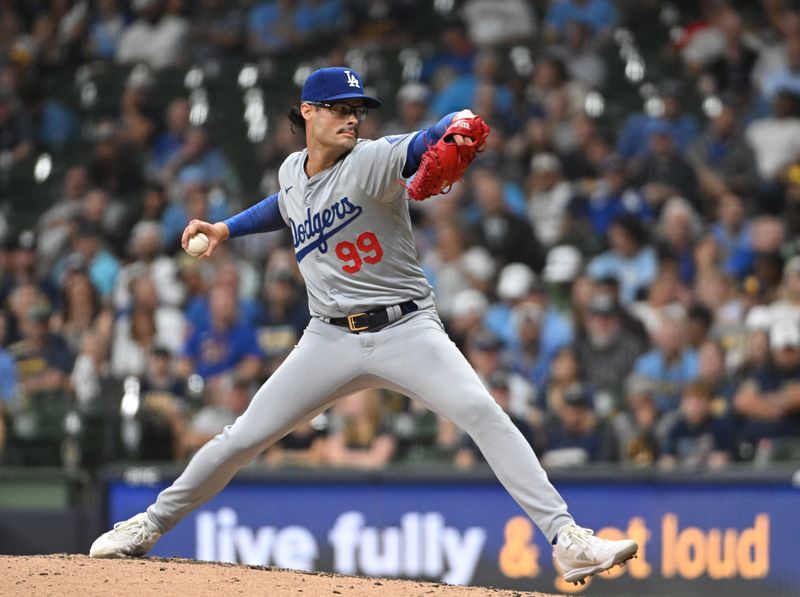 Aug 12, 2024; Milwaukee, Wisconsin, USA; Los Angeles Dodgers pitching coach Mark Prior (99) delivers a pitch against the Milwaukee Brewers in the sixth inning at American Family Field. Mandatory Credit: Michael McLoone-USA TODAY Sports