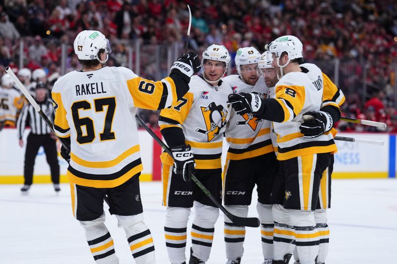 Jan 3, 2025; Sunrise, Florida, USA;  Pittsburgh Penguins center Sidney Crosby (87) celebrates with teammates after scroing against the Florida Panthers during the second period at Amerant Bank Arena. Mandatory Credit: Rich Storry-Imagn Images