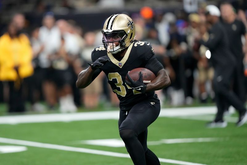 New Orleans Saints running back Tony Jones Jr. (34) warms up before an NFL football game against the Tennessee Titans in New Orleans, Sunday, Sept. 10, 2023. (AP Photo/Gerald Herbert)