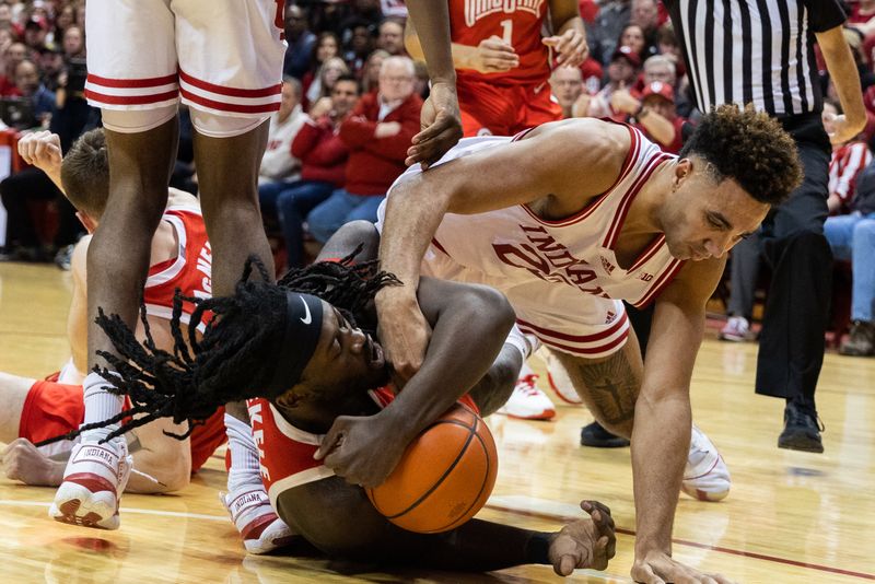 Jan 28, 2023; Bloomington, Indiana, USA; Indiana Hoosiers forward Trayce Jackson-Davis (23) and Ohio State Buckeyes guard Isaac Likekele (13) fight for the ball in the first half at Simon Skjodt Assembly Hall. Mandatory Credit: Trevor Ruszkowski-USA TODAY Sports