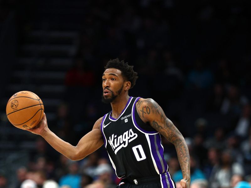 CHARLOTTE, NORTH CAROLINA - JANUARY 10: Malik Monk #0 of the Sacramento Kings attempts a pass during the second half of the game against the Charlotte Hornets at Spectrum Center on January 10, 2024 in Charlotte, North Carolina. NOTE TO USER: User expressly acknowledges and agrees that, by downloading and or using this photograph, User is consenting to the terms and conditions of the Getty Images License Agreement.<p><br/></p> (Photo by Jared C. Tilton/Getty Images)