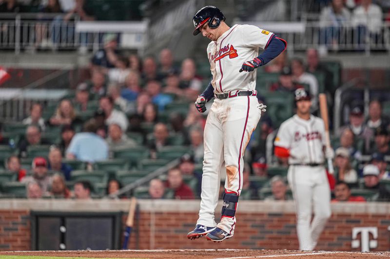 Apr 23, 2024; Cumberland, Georgia, USA; Atlanta Braves third base Austin Riley (27) reacts after being hit by a pitch against the Miami Marlins during the seventh inning at Truist Park. Mandatory Credit: Dale Zanine-USA TODAY Sports