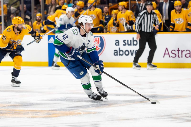 May 3, 2024; Nashville, Tennessee, USA; Vancouver Canucks defenseman Quinn Hughes (43) skates with the puck against the Nashville Predators during the second period in game six of the first round of the 2024 Stanley Cup Playoffs at Bridgestone Arena. Mandatory Credit: Steve Roberts-USA TODAY Sports