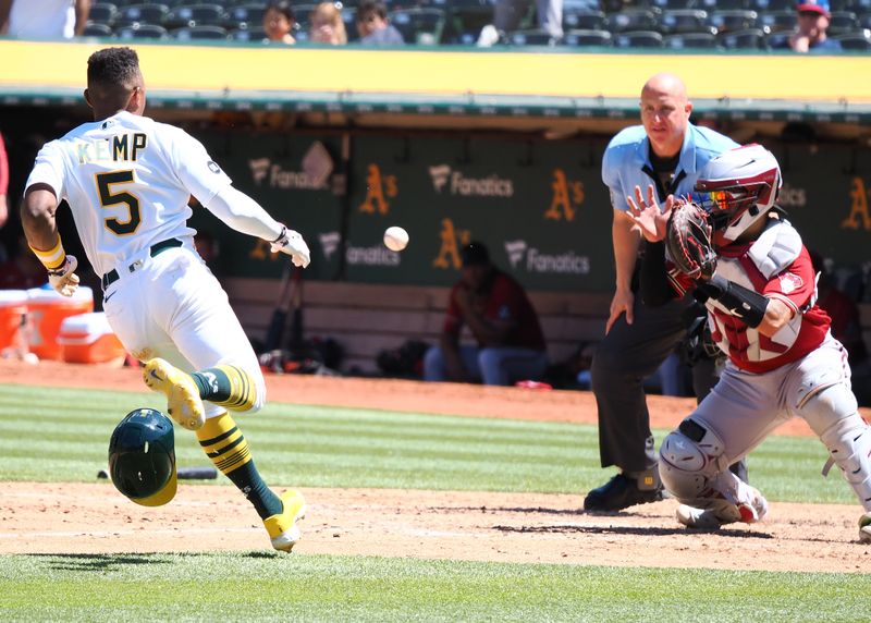 May 17, 2023; Oakland, California, USA; Arizona Diamondbacks catcher Jose Herrera (11) catches the ball before taggin out Oakland Athletics second baseman Tony Kemp (5) during the seventh inning at Oakland-Alameda County Coliseum. Mandatory Credit: Kelley L Cox-USA TODAY Sports