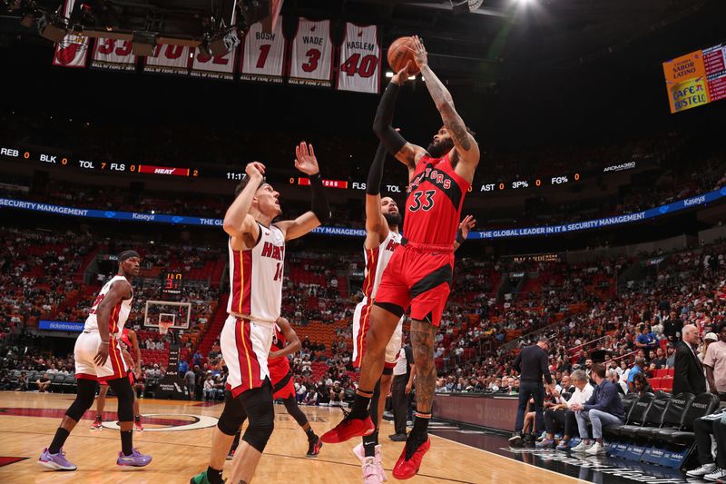 MIAMI, FL - APRIL 12:  Gary Trent Jr. #33 of the Toronto Raptors shoots the ball during the game against the Miami Heat on April 12, 2024 at Kaseya Center in Miami, Florida. NOTE TO USER: User expressly acknowledges and agrees that, by downloading and or using this Photograph, user is consenting to the terms and conditions of the Getty Images License Agreement. Mandatory Copyright Notice: Copyright 2024 NBAE (Photo by Issac Baldizon/NBAE via Getty Images)