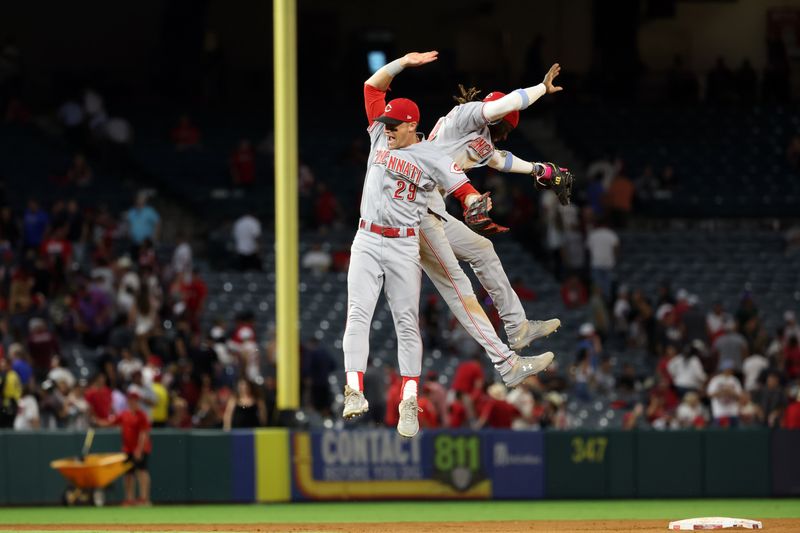 Aug 22, 2023; Anaheim, California, USA; Cincinnati Reds shortstop Elly De La Cruz (44) and center fielder TJ Friedl (29) celebrate a victory after defeating the Los Angeles Angels 4-3 at Angel Stadium. Mandatory Credit: Kiyoshi Mio-USA TODAY Sports