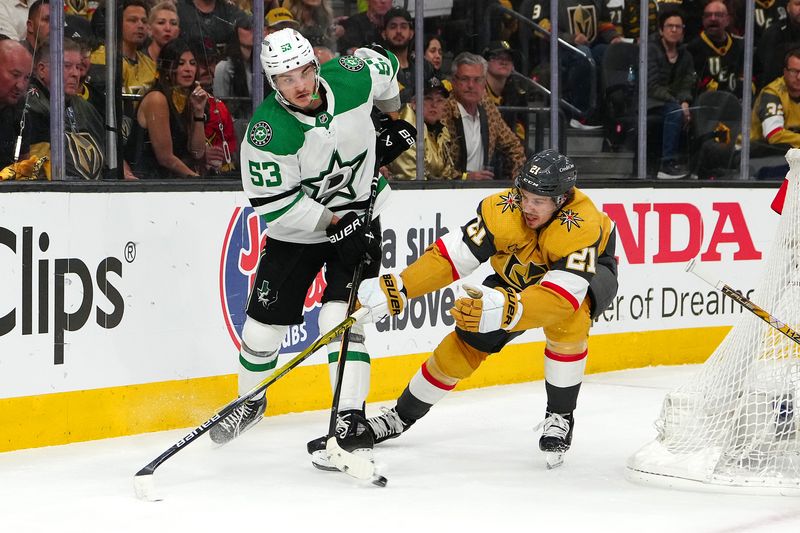 May 3, 2024; Las Vegas, Nevada, USA; Dallas Stars center Wyatt Johnston (53) centers the puck in front of Vegas Golden Knights center Brett Howden (21) during the second period of  game six of the first round of the 2024 Stanley Cup Playoffs at T-Mobile Arena. Mandatory Credit: Stephen R. Sylvanie-USA TODAY Sports